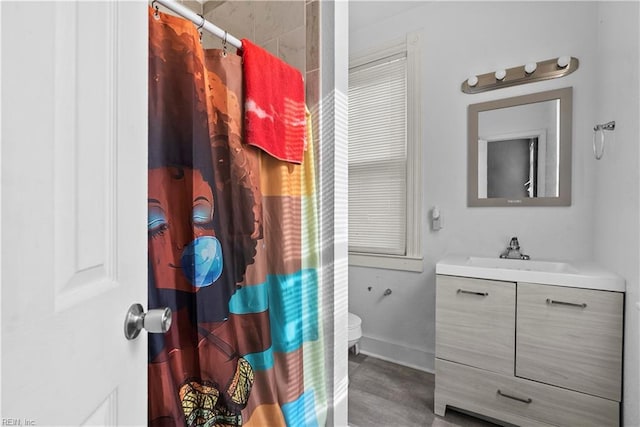 bathroom featuring a shower with shower curtain, vanity, toilet, and wood-type flooring