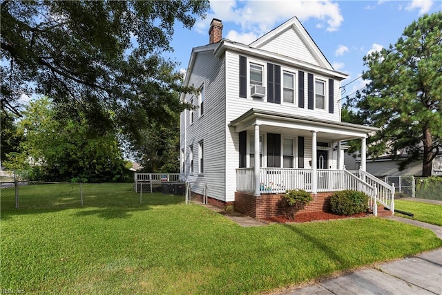 view of front of property featuring cooling unit, covered porch, and a front yard