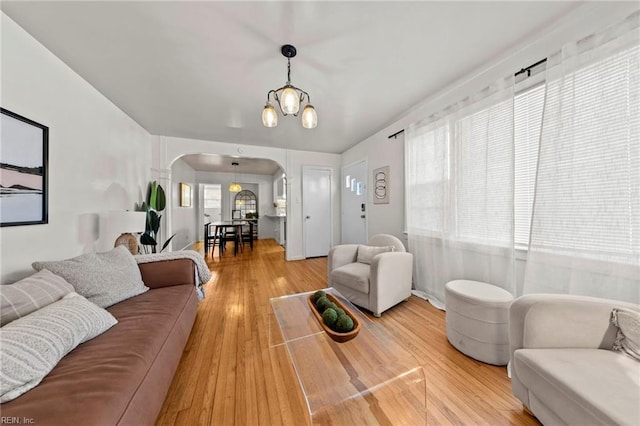 living room featuring a chandelier and hardwood / wood-style flooring