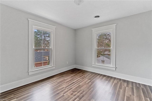 spare room with hardwood / wood-style flooring