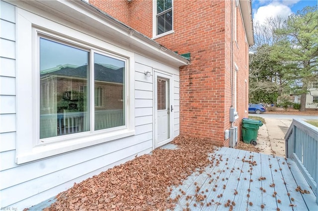 view of side of home with a deck