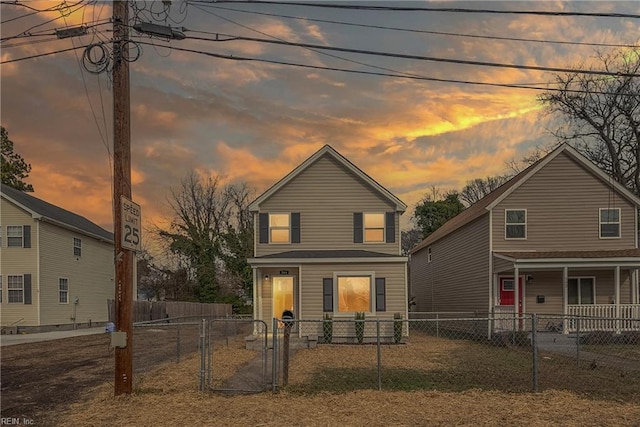 view of back house at dusk