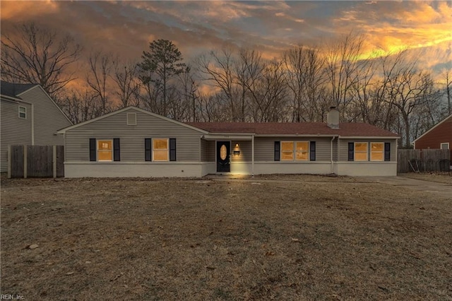 ranch-style house featuring a yard