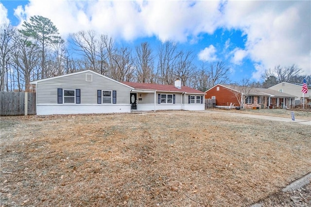 ranch-style home with a front lawn