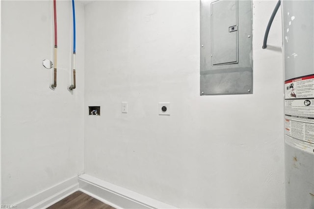 laundry room featuring hookup for an electric dryer, washer hookup, water heater, hardwood / wood-style floors, and electric panel