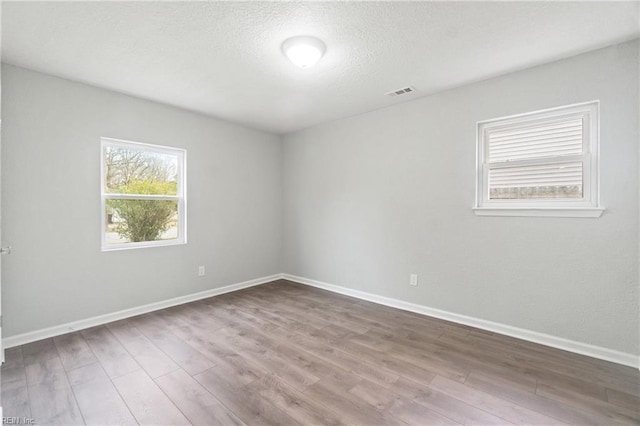 unfurnished room featuring wood-type flooring