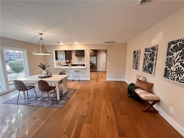 dining space featuring light hardwood / wood-style floors