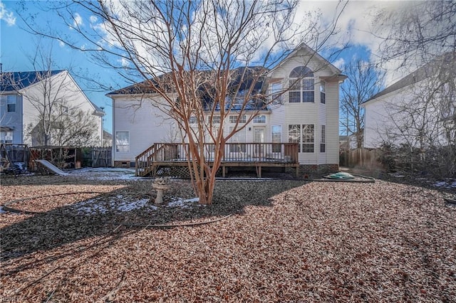 back of house featuring a wooden deck