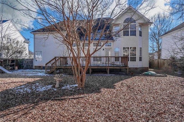 rear view of property with a wooden deck