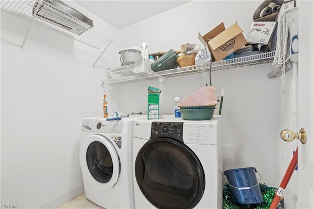 laundry room featuring washing machine and clothes dryer