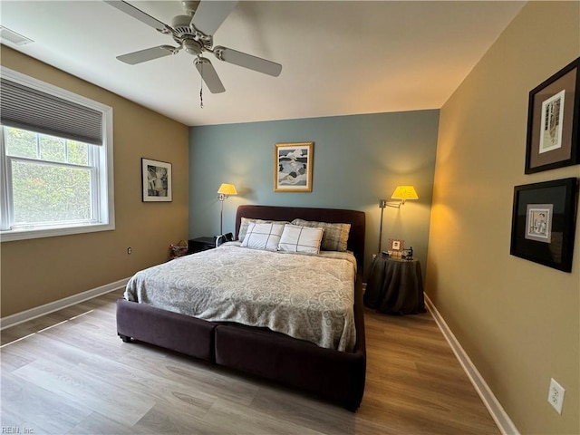 bedroom featuring ceiling fan and light wood-type flooring