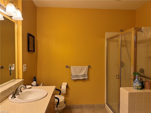 bathroom with tile patterned floors, vanity, toilet, and walk in shower