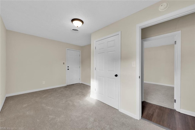 unfurnished bedroom featuring carpet flooring