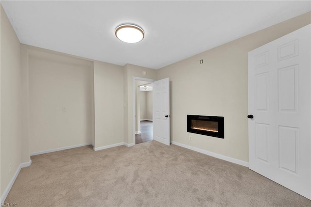 unfurnished bedroom with light colored carpet