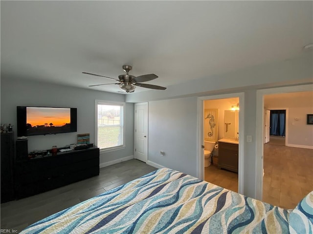 bedroom featuring ceiling fan, light wood-type flooring, and ensuite bathroom