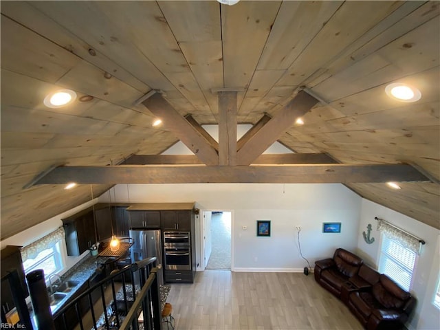 additional living space featuring lofted ceiling, a healthy amount of sunlight, light wood-type flooring, and wooden ceiling