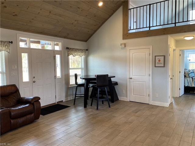 interior space featuring high vaulted ceiling, wood ceiling, and plenty of natural light