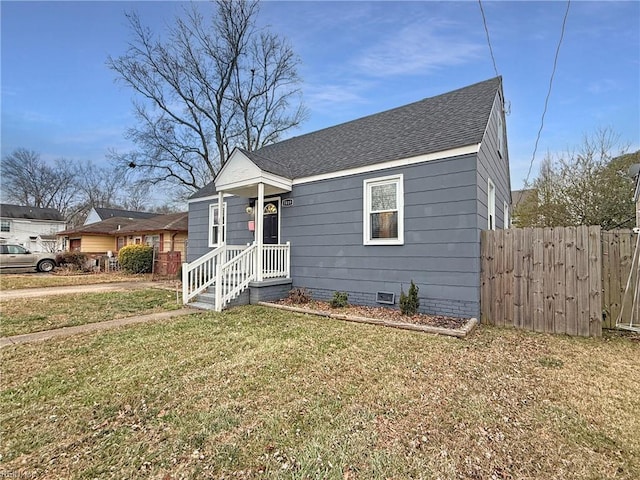 bungalow-style house with a front yard