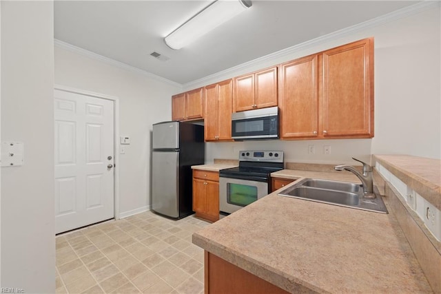 kitchen featuring crown molding, sink, and stainless steel appliances