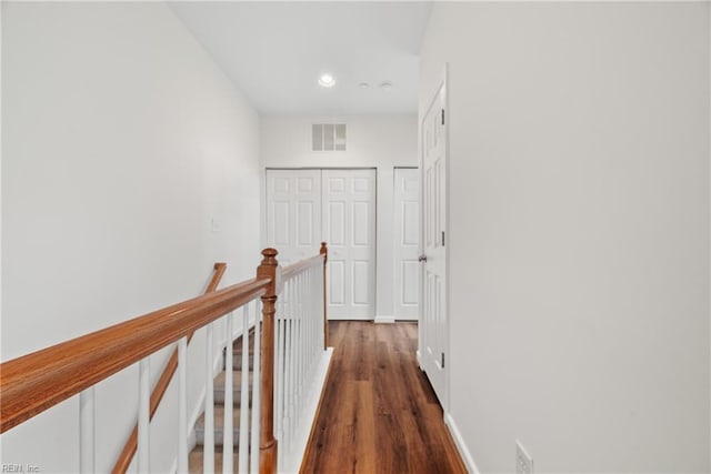 corridor featuring dark hardwood / wood-style floors