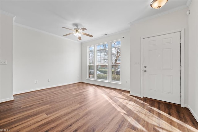 entrance foyer with crown molding, ceiling fan, and dark wood-type flooring