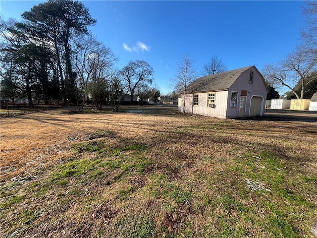 view of yard with an outdoor structure and a garage