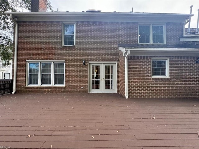 rear view of house featuring french doors and a deck