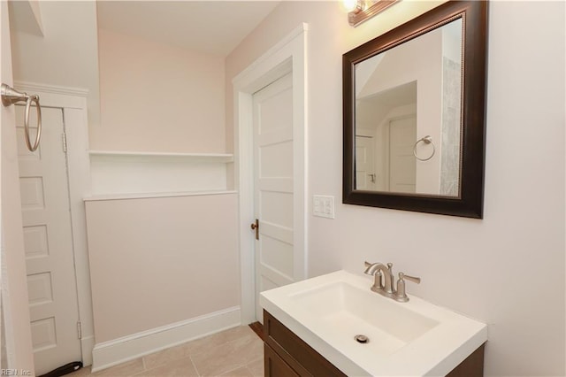 bathroom featuring tile patterned flooring and vanity