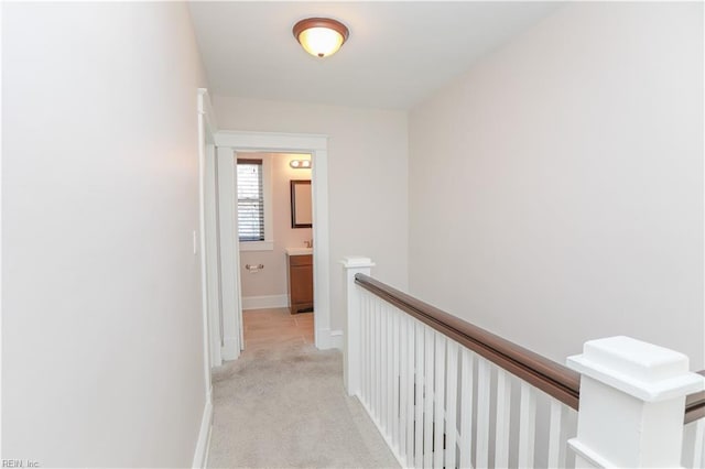 corridor with light colored carpet