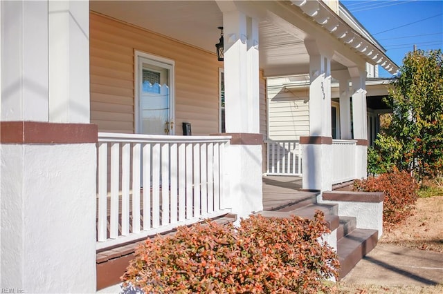 entrance to property featuring covered porch