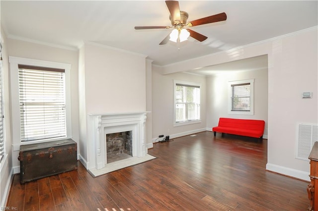 living room with ceiling fan, dark wood-type flooring, and ornamental molding