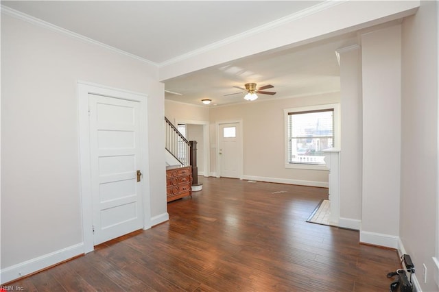 spare room with dark hardwood / wood-style flooring, ceiling fan, and ornamental molding