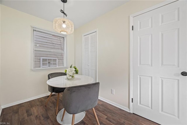 dining space with dark wood-type flooring