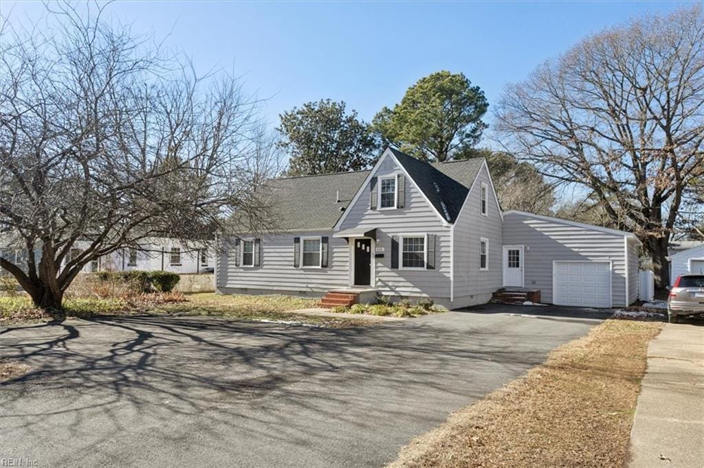 cape cod house with a garage