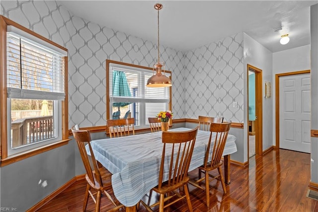 dining room with hardwood / wood-style flooring