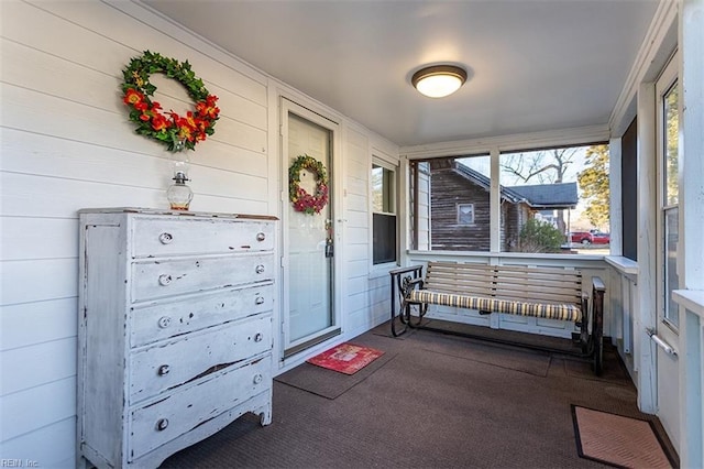 sunroom / solarium featuring plenty of natural light