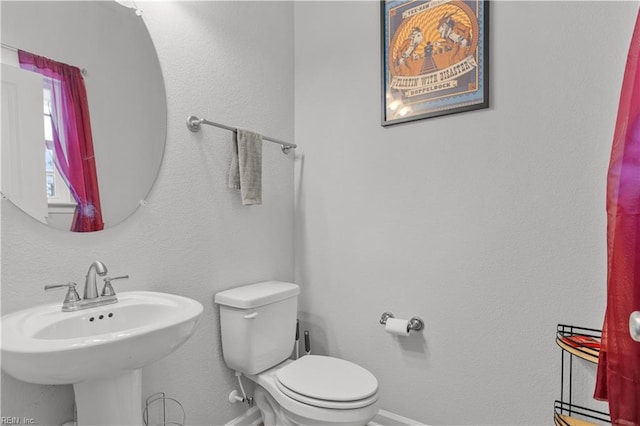 bathroom with sink and toilet