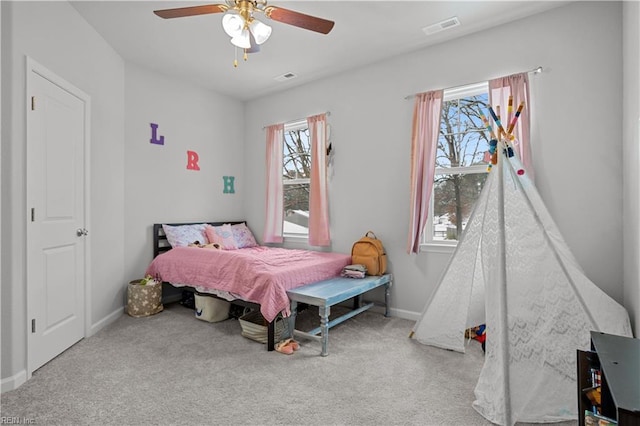 bedroom with ceiling fan and carpet flooring