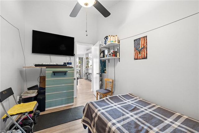 bedroom featuring light hardwood / wood-style flooring and ceiling fan