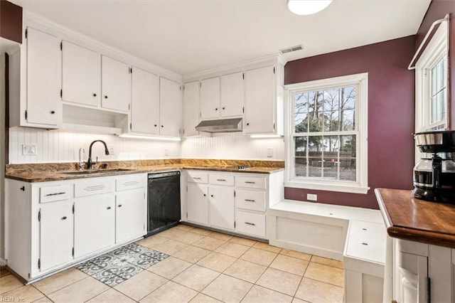 kitchen featuring light tile patterned floors, white cabinetry, dishwasher, and sink