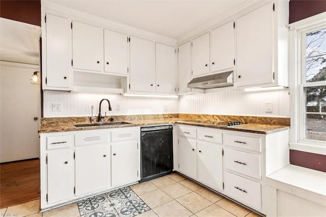 kitchen featuring black appliances, sink, a wealth of natural light, white cabinetry, and light tile patterned floors