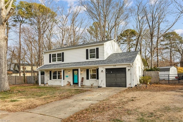 front of property with covered porch and a garage