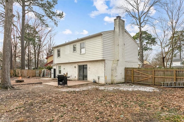 rear view of house featuring a patio