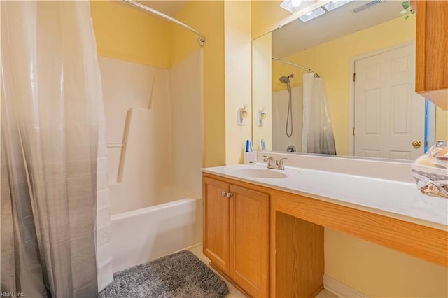 bathroom featuring shower / bath combination with curtain and vanity