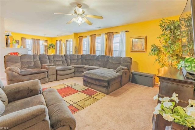 living room featuring light carpet and ceiling fan