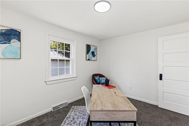 home office with dark colored carpet