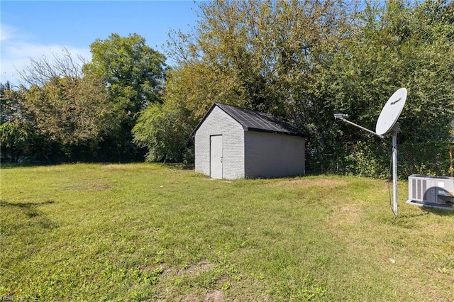 view of yard with a storage unit and central air condition unit