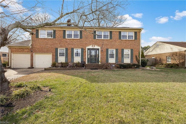 view of front of property featuring a front lawn and a garage