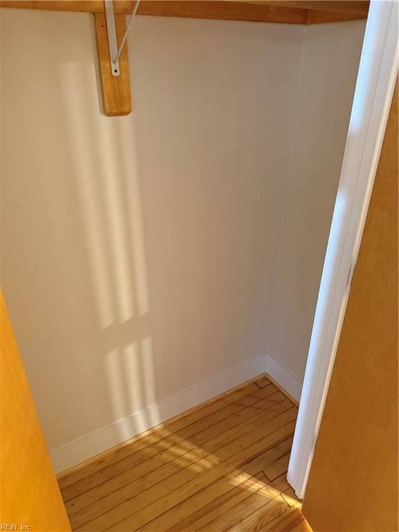 spacious closet with light hardwood / wood-style flooring