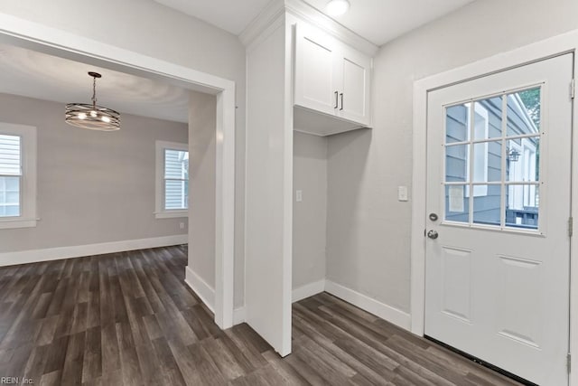 mudroom with a chandelier and dark hardwood / wood-style flooring